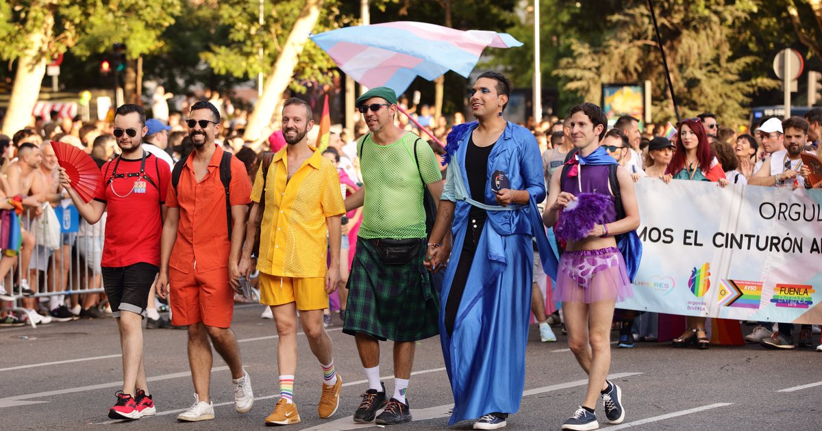 Marchers and crowds at the Madrid Pride parade in central Madrid
